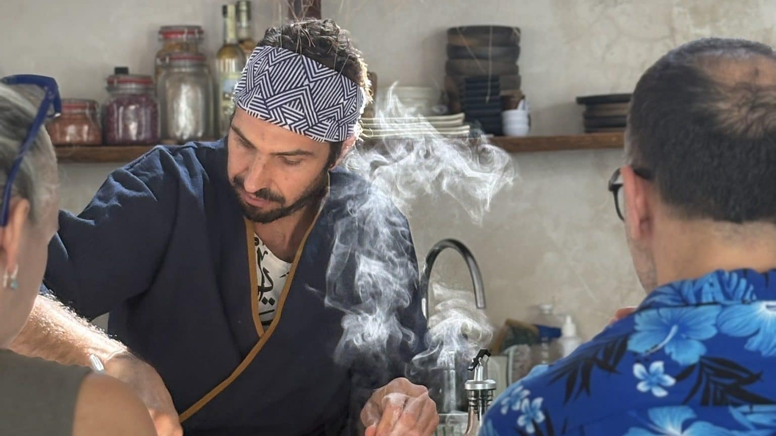 Chef Elliot Fabri teaching a sushi class over a tub of steaming rice