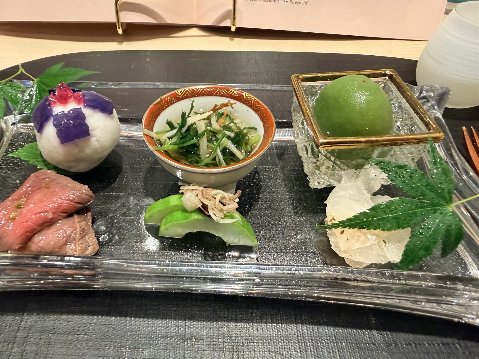 A hassun tray of small seasonal dishes at Ise Sueyoshi
