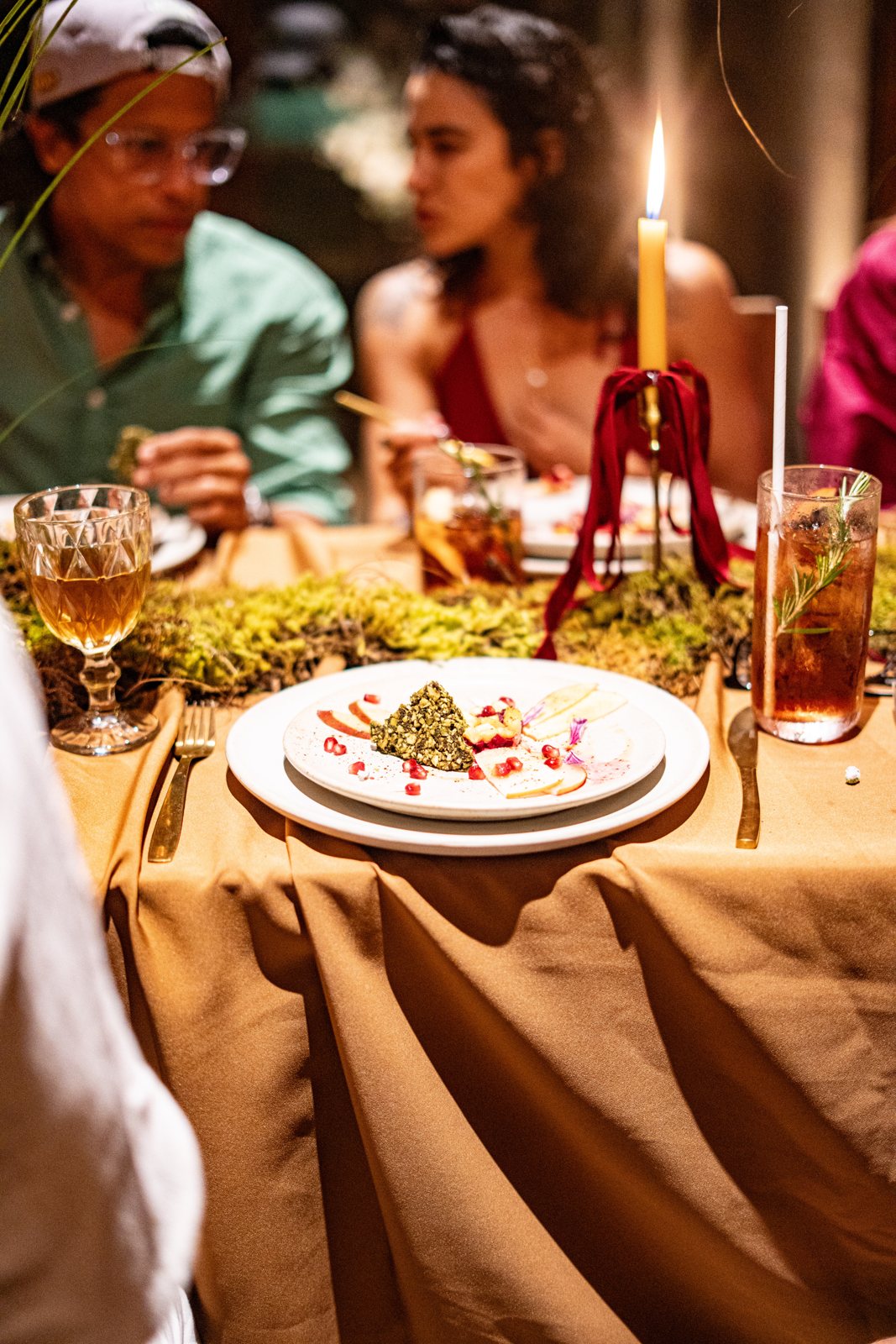 Guests at a candlelit table