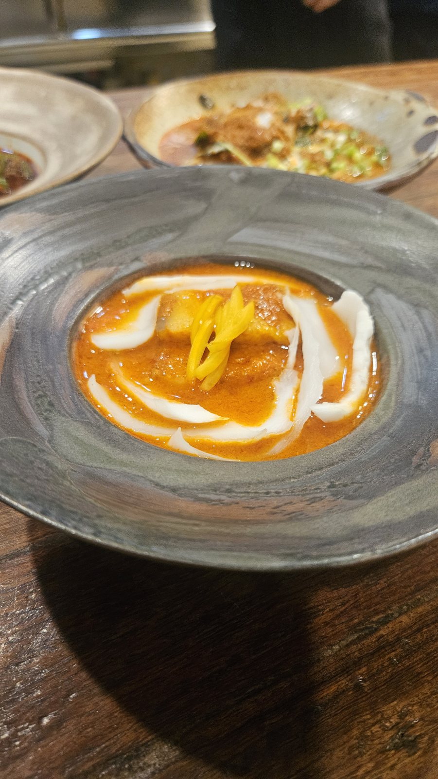 Turtle curry with a swirl of coconut cream