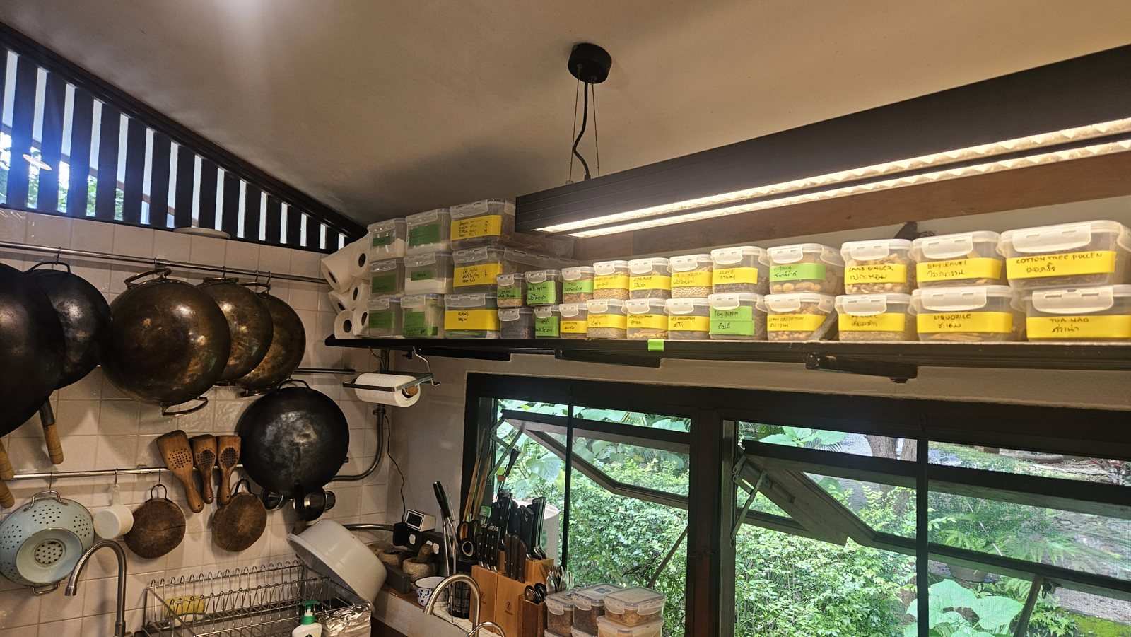 Shelves of hand-labelled pastes and powders in the Three Trees kitchen