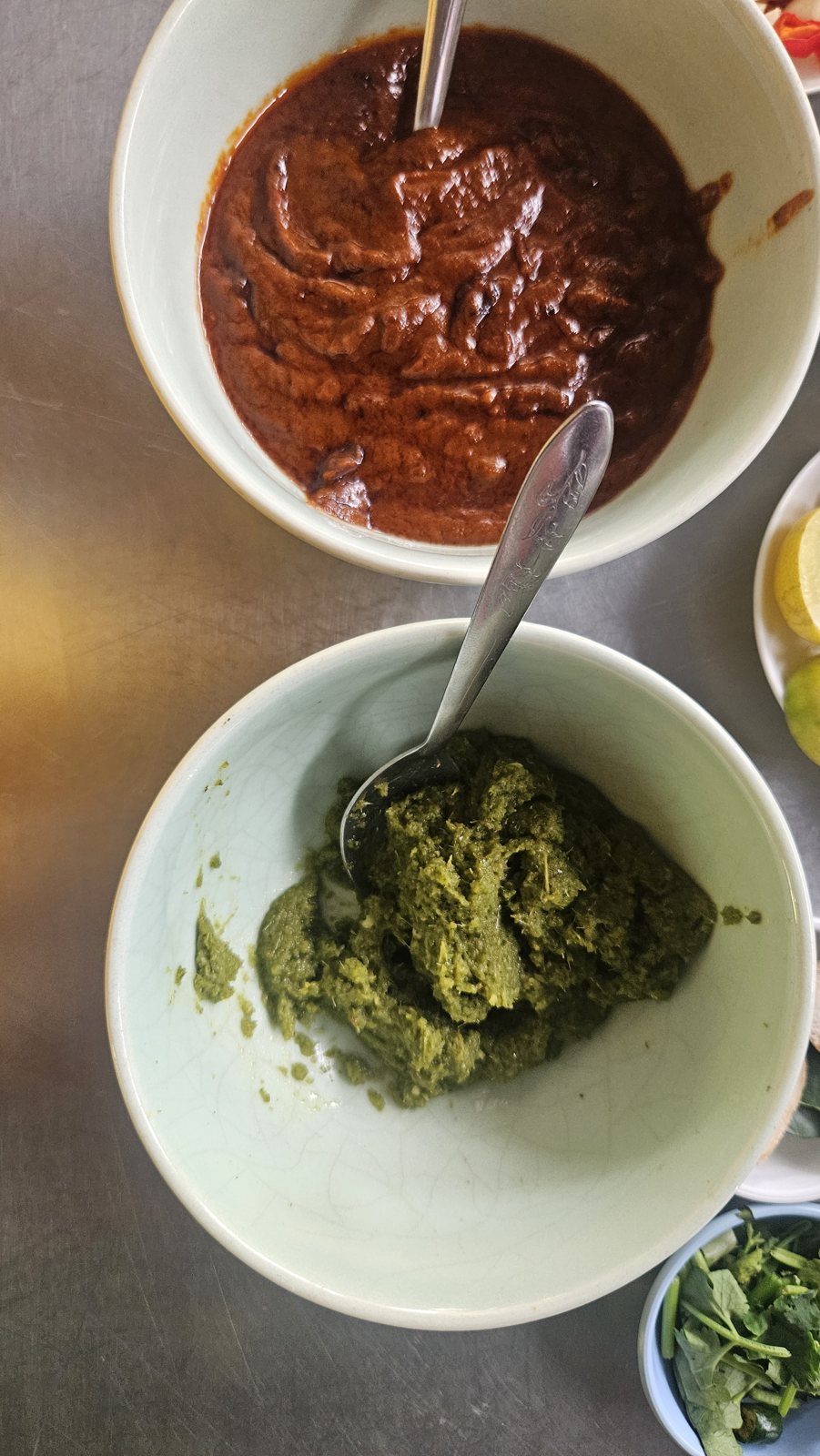 Red and green curry paste, pounded by hand