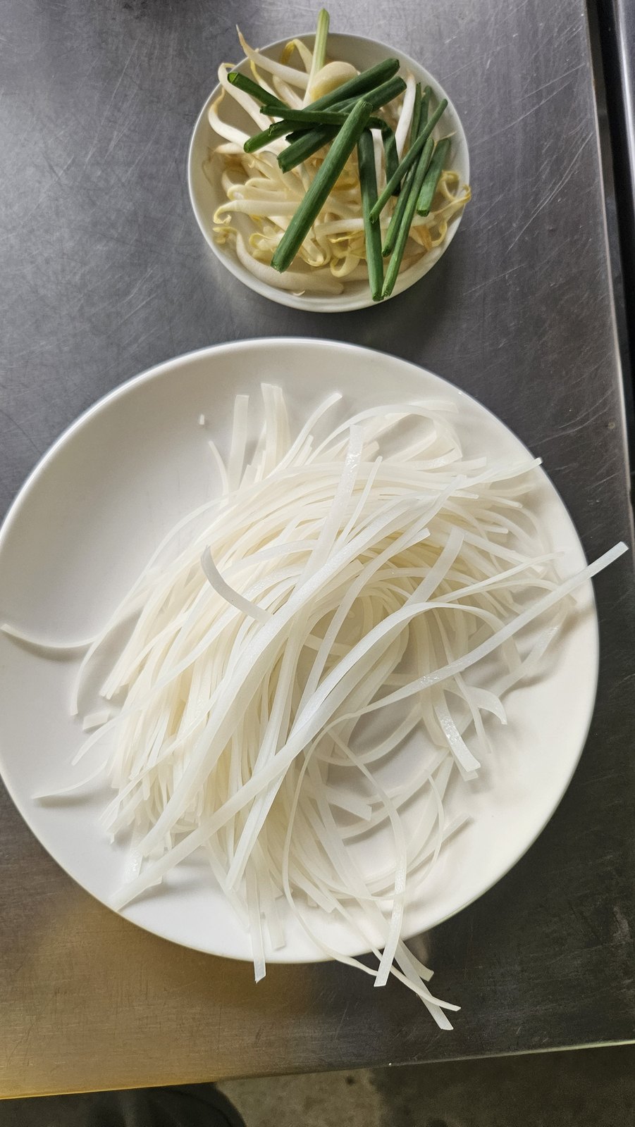 Fresh rice noodles and greens for khao soi