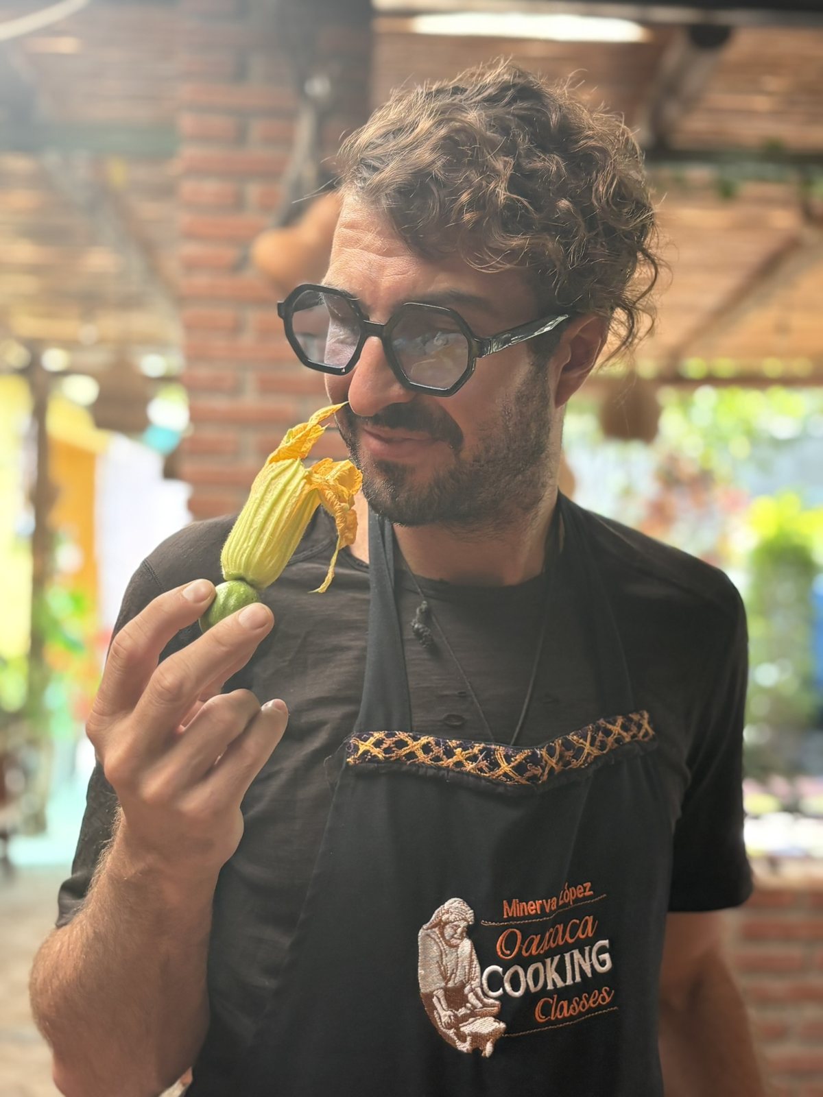 Chef Elliot tasting the squash blossom