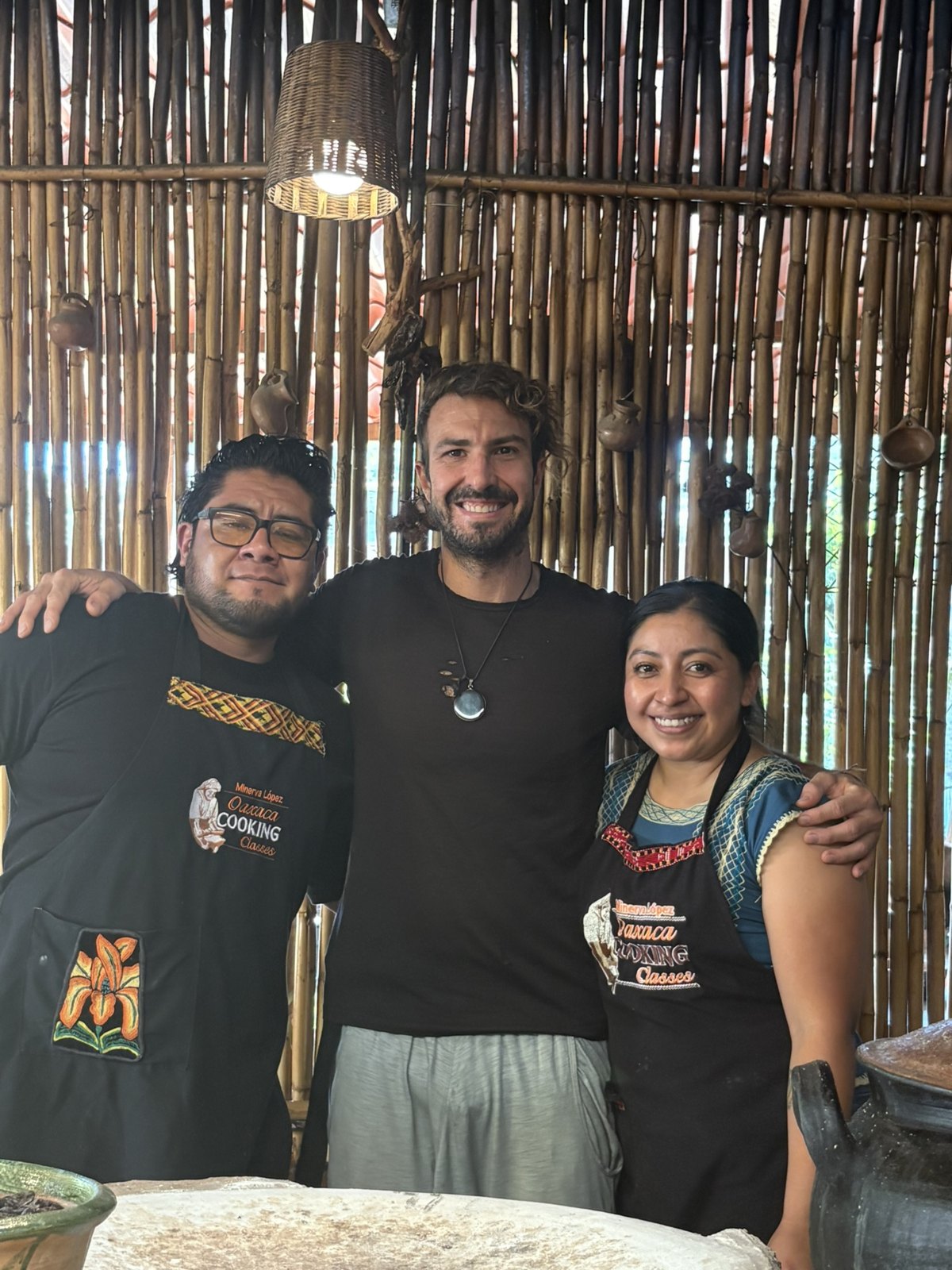 Chef Elliot with the two teachers at the bamboo wall