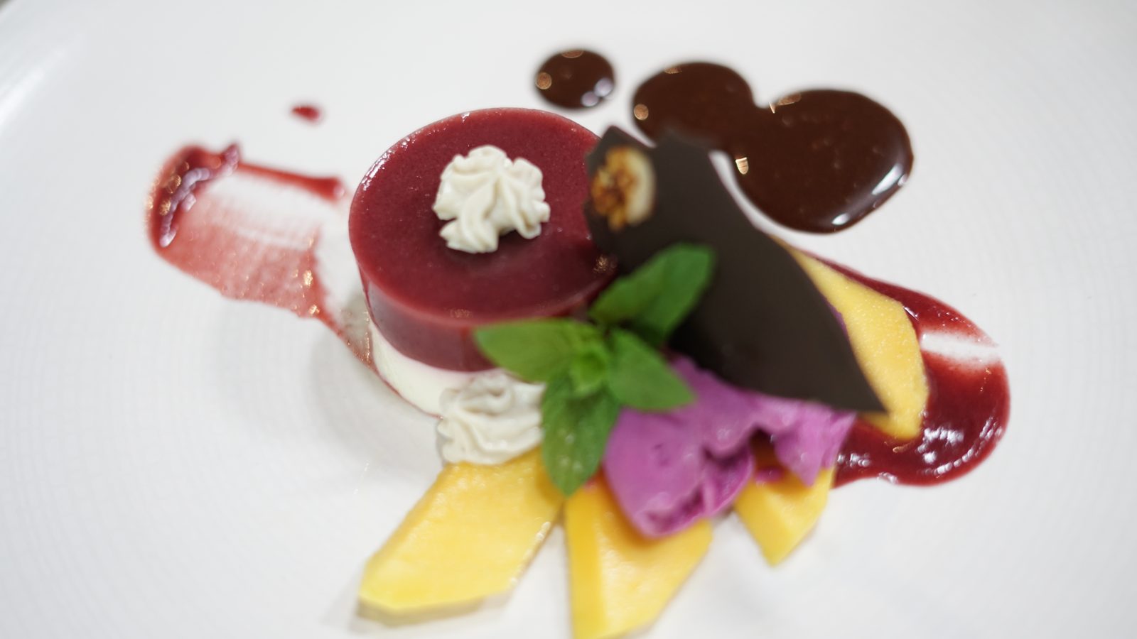 Beet and mango dessert with chocolate and fresh mint